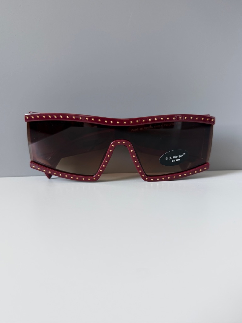 ASOS AJ Morgan burgundy maroon gold stud disco shield oversized sunglasses